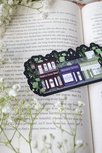 ACOTAR A Walk in Velaris Bookmark is an imagined velaris scene with fake shops like Nesta's bookstore, Elain's community garden (with only flowers in it), Feyre's Art Academy, Rhysand's Tattoo Parlor, and the Suriels Cloak Shop/ Tea Room. Inspired from A Court of Mist and Fury by Sarah J. Maas.