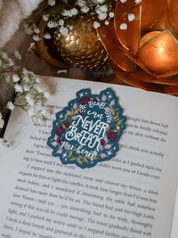 This officially licensed Serpent and The Wings of Night sticker from the Crowns of Nyaxia by Carissa Broadbent features cream text on a deep teal background with maroon, mauve, and green foliage surrounded by little stars and magic bubbles.