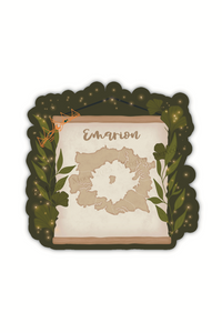 Spark of The Everflame Emarion Map Sticker. From The Kindred's Curse Saga by Penn Cole. This Licensed sticker has a dark green background with a banner showing a map of Emarion on it, with Diem's Lumnos crown hanging off the corner.