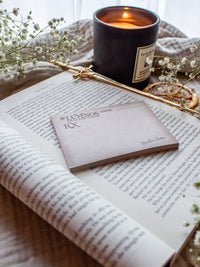 Spark of The Everflame Lumnos Healers Clinic RX Notepad. Inspired by the Kindreds Curse Saga by Penn Cole. This licensed 3"x4" post-it notepad looks like aged parchment, and has "Lumnos Healers Clinic - RX"  and a date line along the top then its signed off by Diem on the bottom corner.