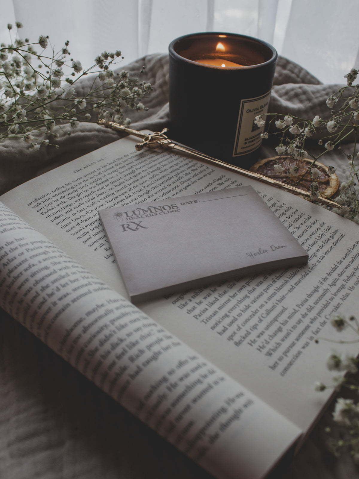 Spark of The Everflame Lumnos Healers Clinic RX Notepad. Inspired by the Kindreds Curse Saga by Penn Cole. This licensed 3"x4" post-it notepad looks like aged parchment, and has "Lumnos Healers Clinic - RX"  and a date line along the top then its signed off by Diem on the bottom corner.