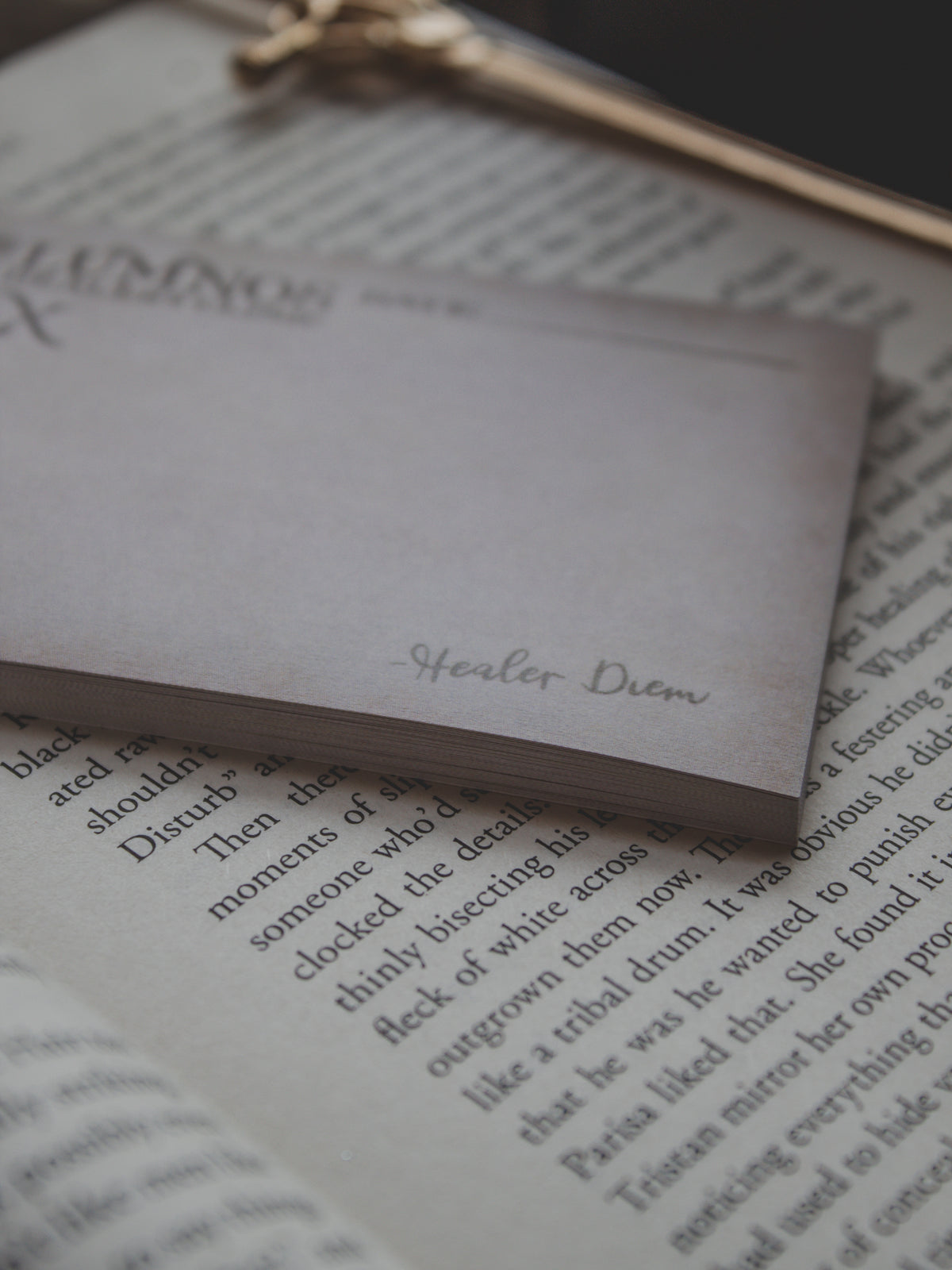 Spark of The Everflame Lumnos Healers Clinic RX Notepad. Inspired by the Kindreds Curse Saga by Penn Cole. This licensed 3"x4" post-it notepad looks like aged parchment, and has "Lumnos Healers Clinic - RX"  and a date line along the top then its signed off by Diem on the bottom corner.