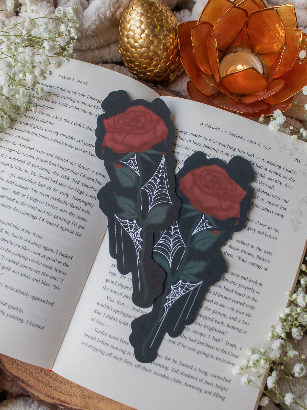 This bloody spooky Halloween rose is bright blood red with blood dripping off of it. It has little spiderwebs throughout the leaves on the stem.