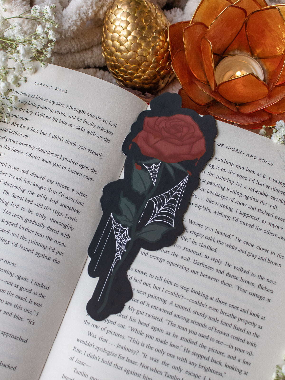 This bloody spooky Halloween rose is bright blood red with blood dripping off of it. It has little spiderwebs throughout the leaves on the stem.