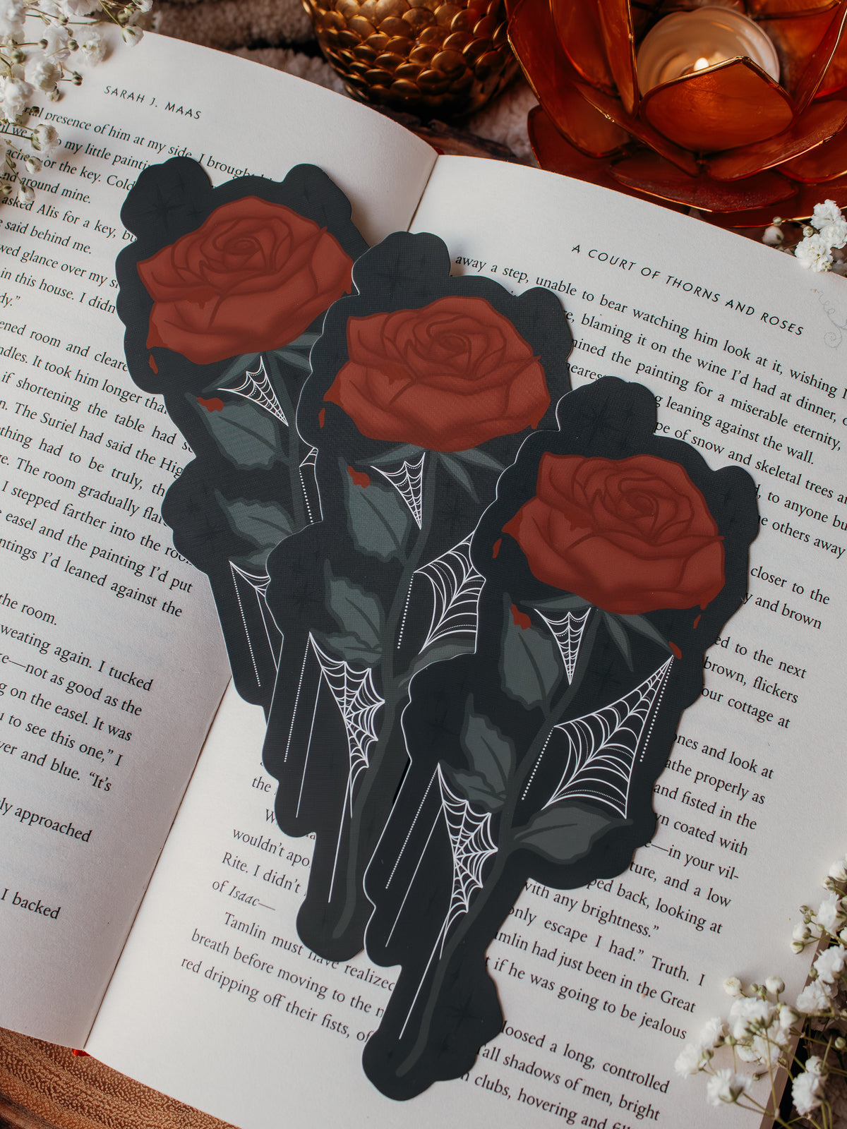 This bloody spooky Halloween rose is bright blood red with blood dripping off of it. It has little spiderwebs throughout the leaves on the stem.