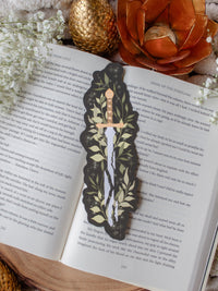 Broken Fantasy Sword Die-Cut Bookmark on an open book
