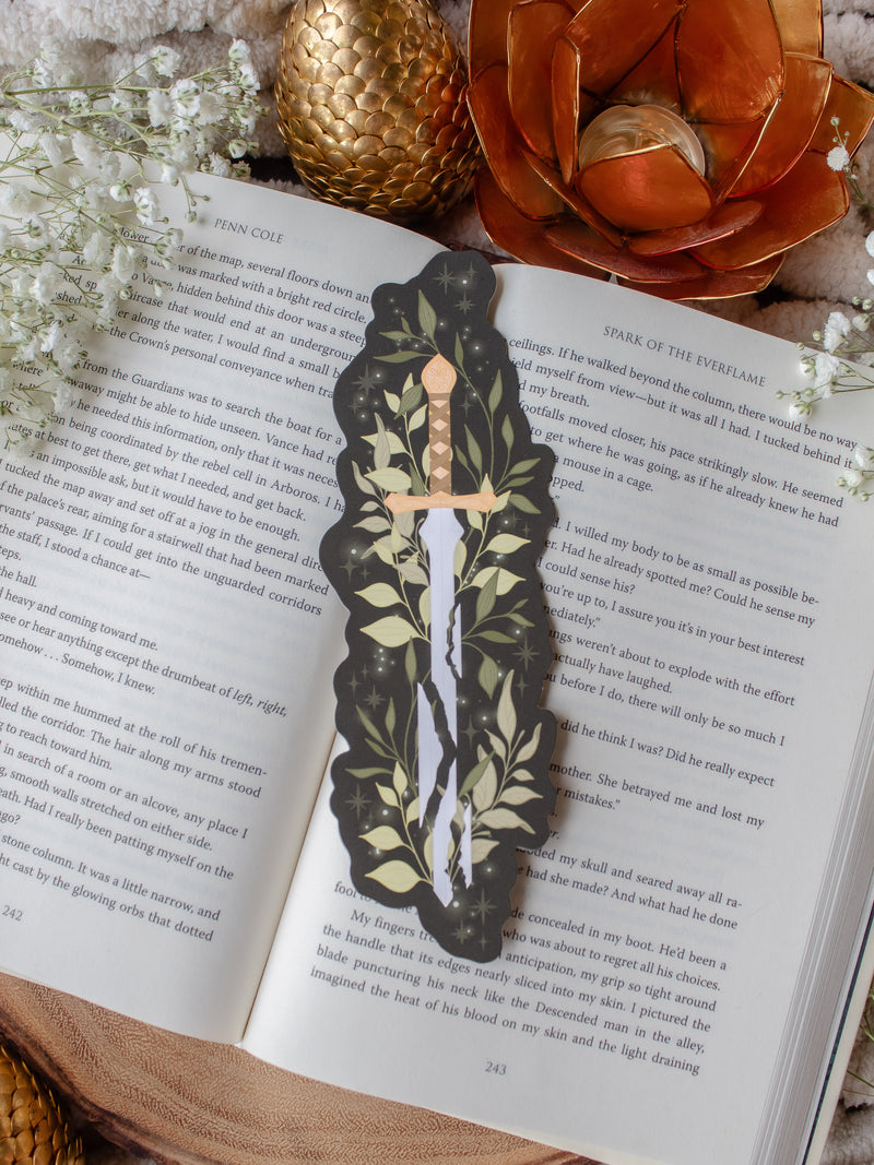 Broken Fantasy Sword Die-Cut Bookmark on an open book