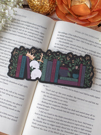Dark Fantasy Reader Bookshelf Die-Cut Bookmark placed on a book