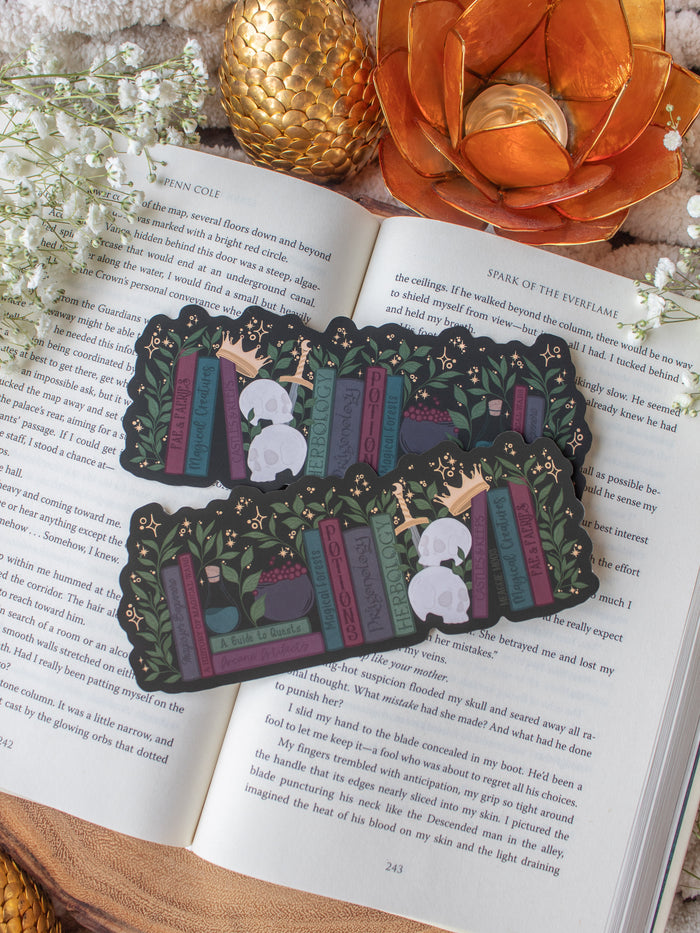 Dark Fantasy Reader Bookshelf Die-Cut Bookmark placed on a book