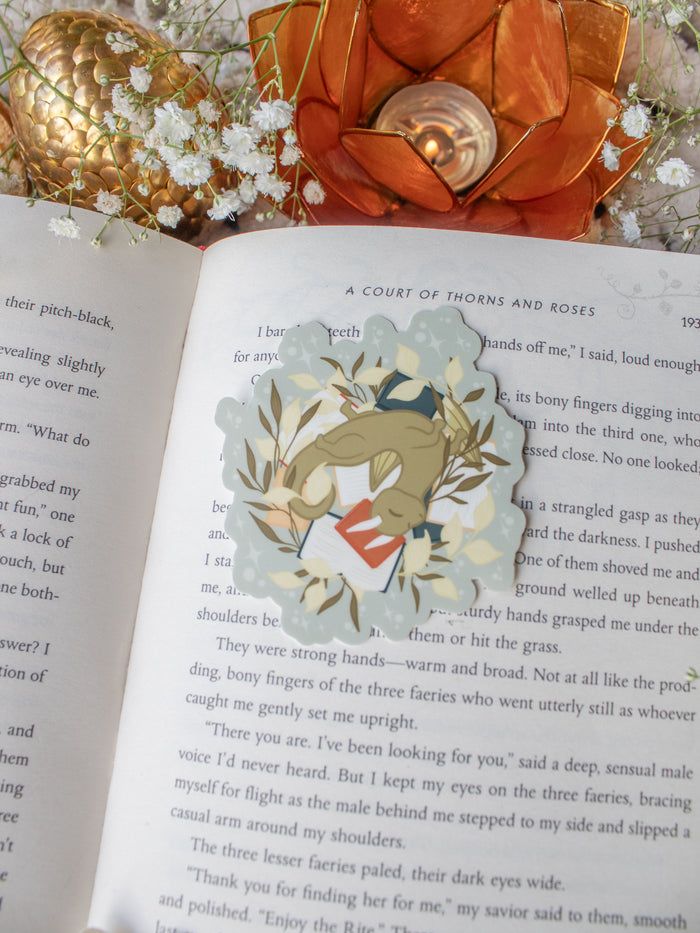 Littlest Book Dragon Rolling on Her Books Waterproof Vinyl Sticker | 3" x2.8"