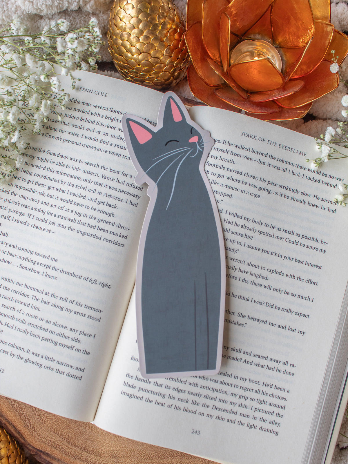 Little Grey Kitty Cat Die-Cut Bookmark on a book with baby's breath and other decorative elements around it.