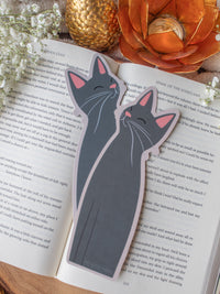 Little Grey Kitty Cat Die-Cut Bookmark on a book with baby's breath and other decorative elements around it.