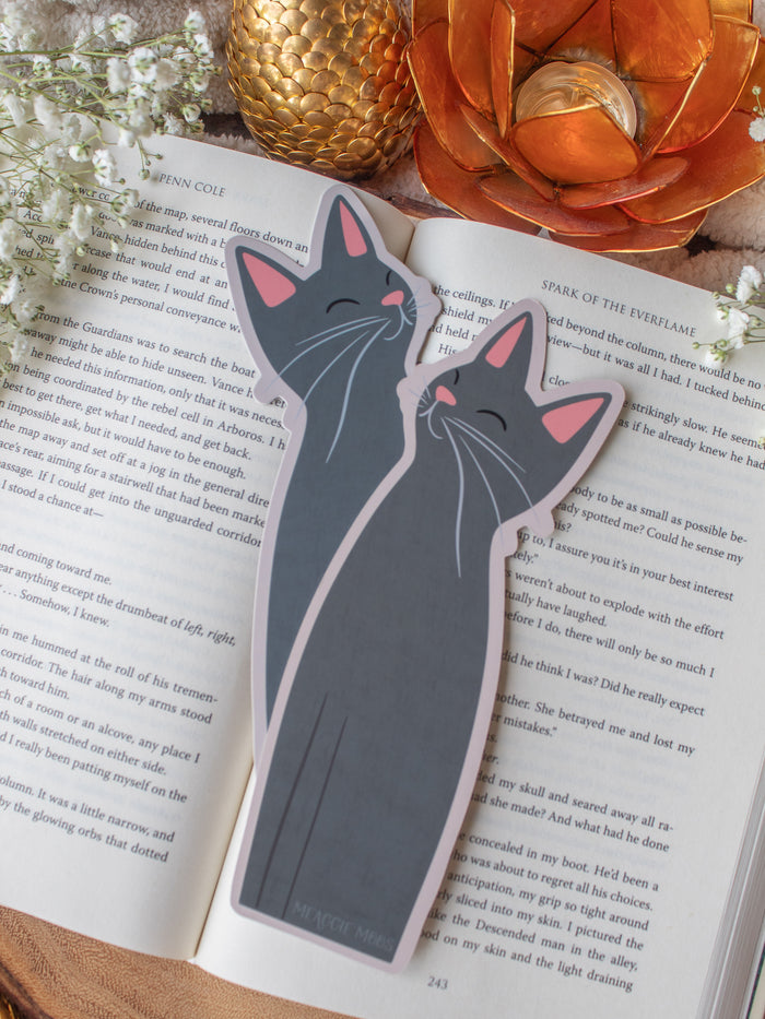 Little Grey Kitty Cat Die-Cut Bookmark on a book with baby's breath and other decorative elements around it.