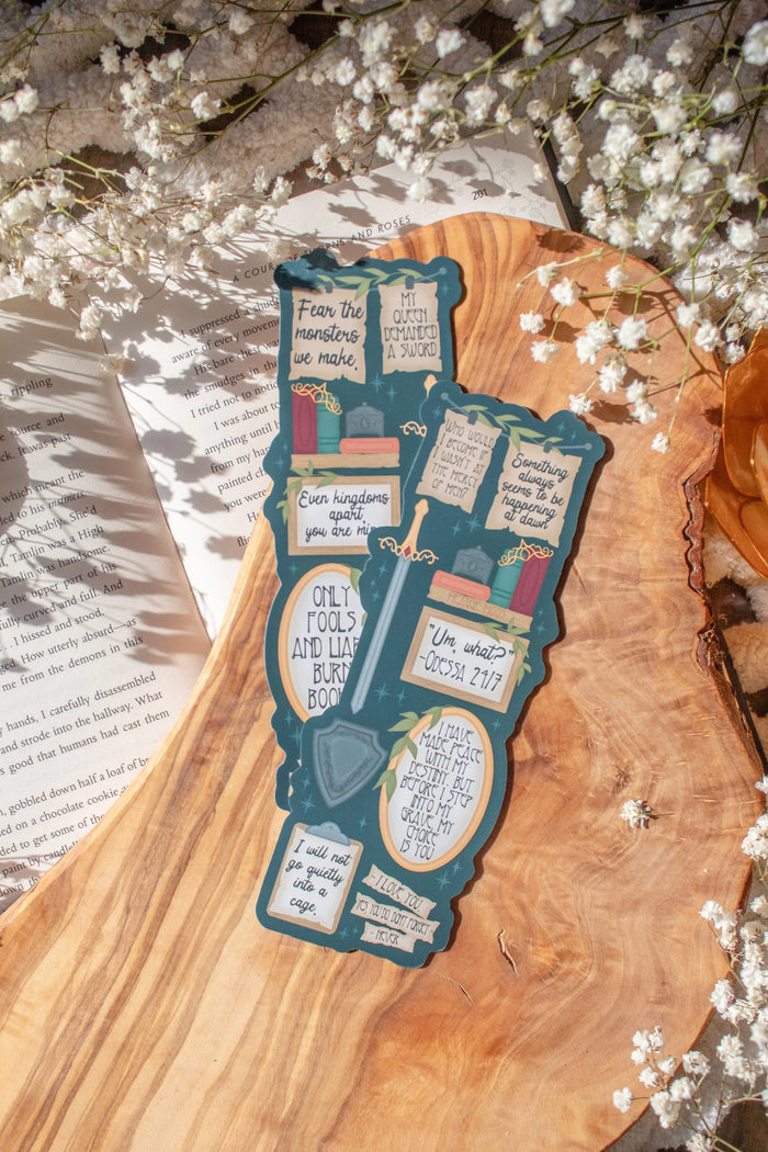 Bookmark inspired by the novel by Devney Perry. This bookmark is dark teal with frames on it with a bunch of different quotes from the book.

The bookmark is laid on an olive wood cutting board, sitting on an open book with little white flowers surrounding it.