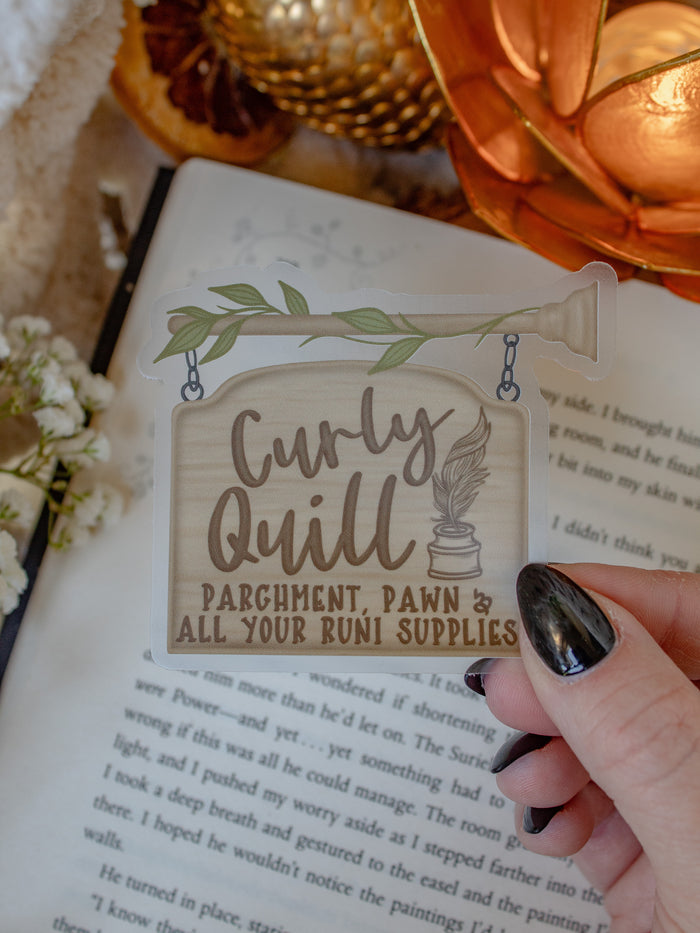This bookish Curly Quill Sign sticker from When The Moon Hatched by Sarah A Parker is on a clear background. 