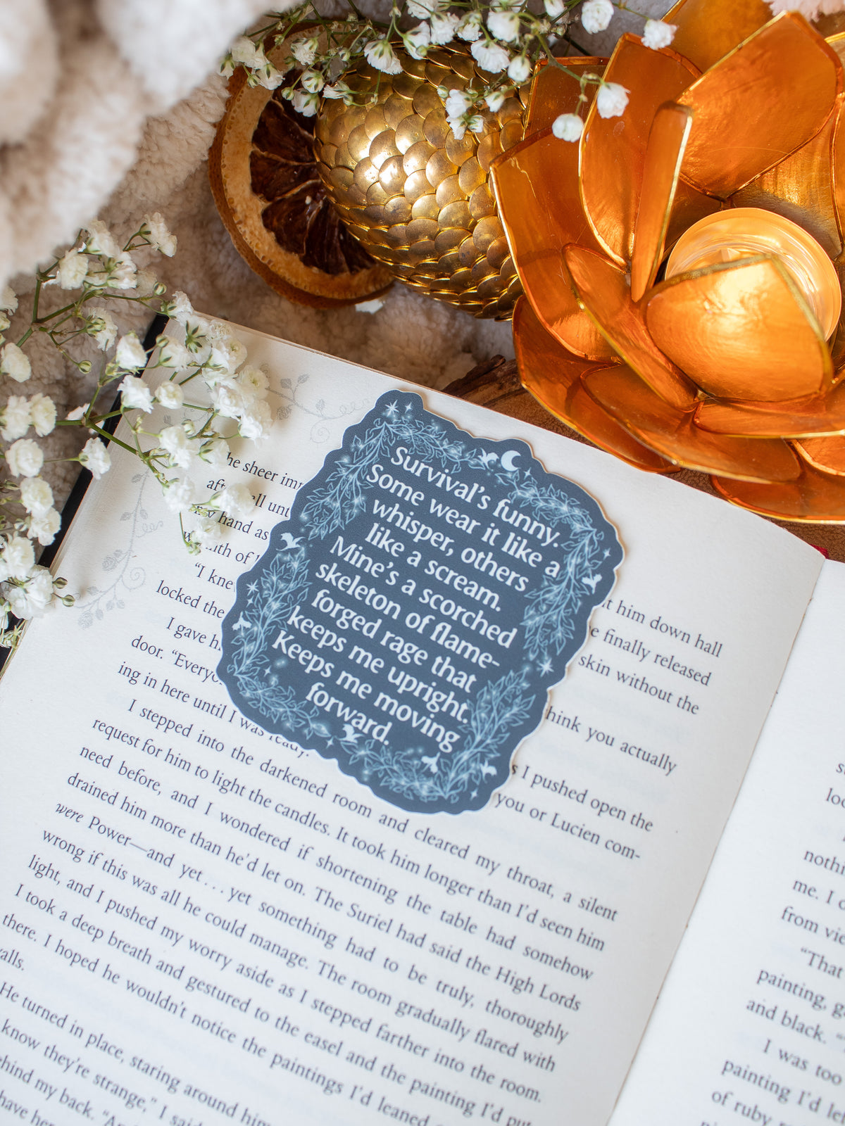 This officially licensed When the Moon Hatched Sticker is slate blue with cream text, and an ivy boarder with little stars, magic bubbles and dragons flying around.