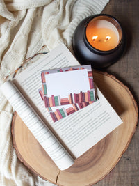 This autumn bookshelf post-it notepad features a bookshelf in autumnal tones, and a white place in the center to write on. 